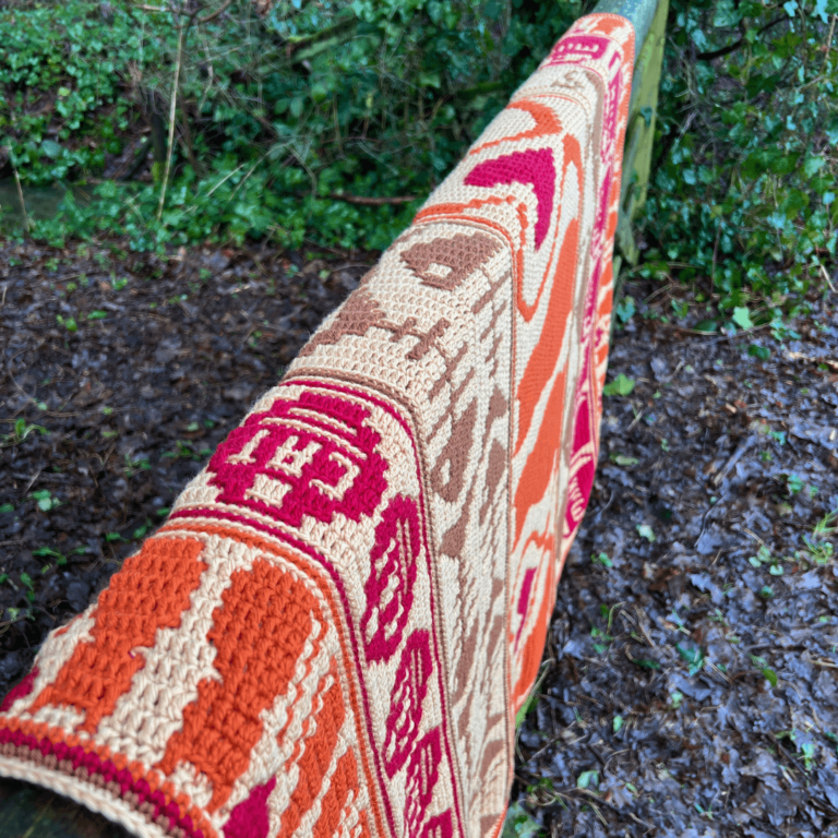 Colorful crochet blanket outdoors