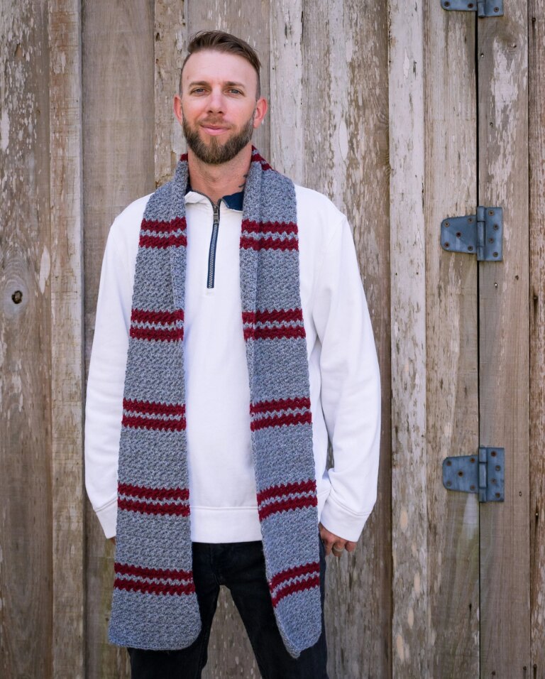 Man wearing striped crochet scarf