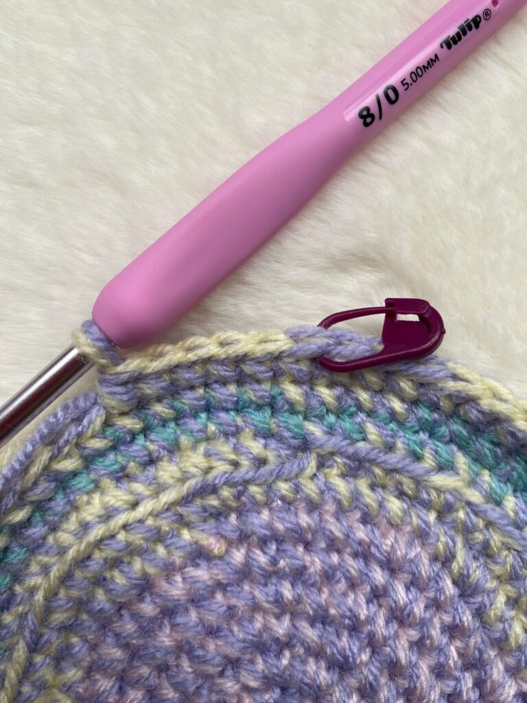 Crochet hook, pastel yarn