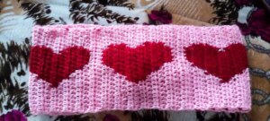 Pink crochet fabric red hearts