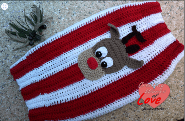 Crocheted reindeer striped blanket