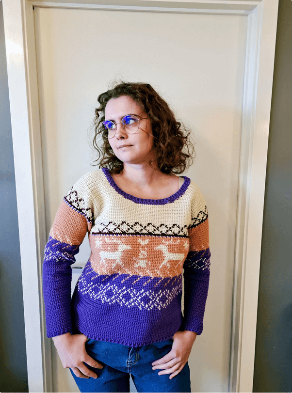 Woman in crochet deer sweater