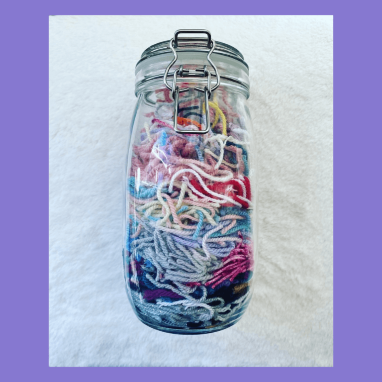 Colorful yarn scraps jar