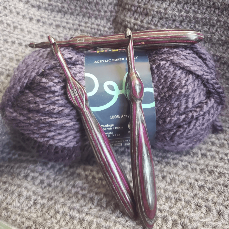 Purple striped crochet hooks yarn
