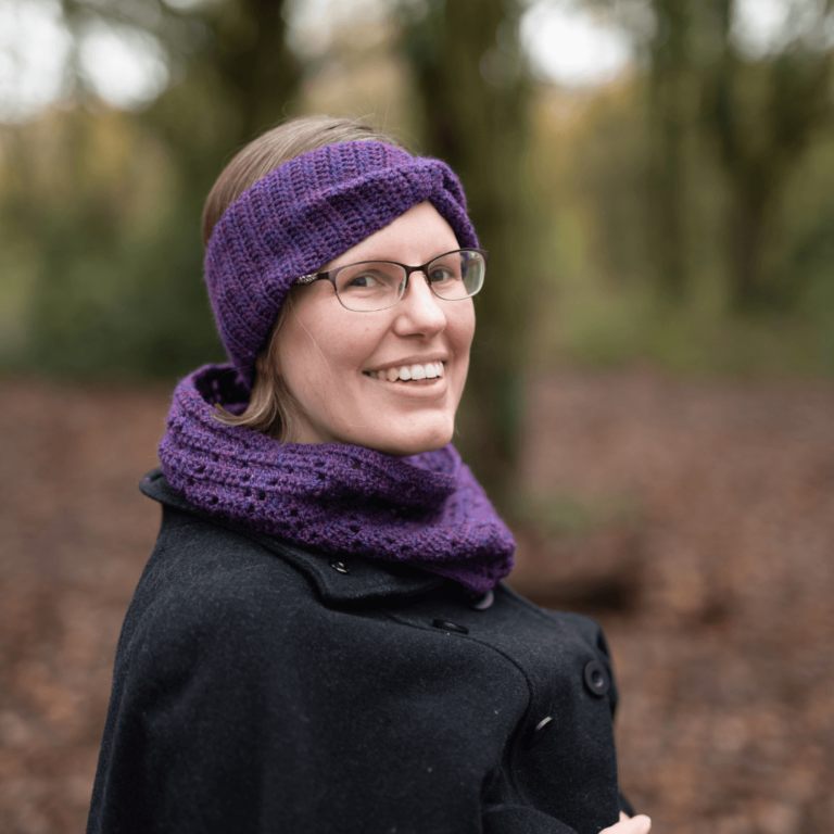 Smiling woman purple knitwear