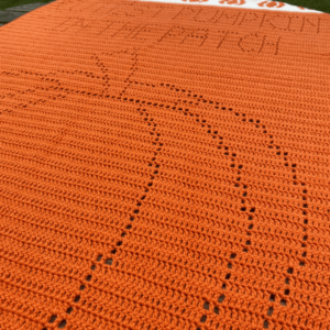 Orange crocheted pumpkin blanket