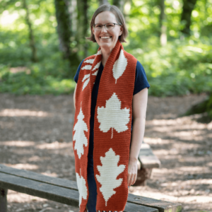 Woman wearing leaf crochet scarf