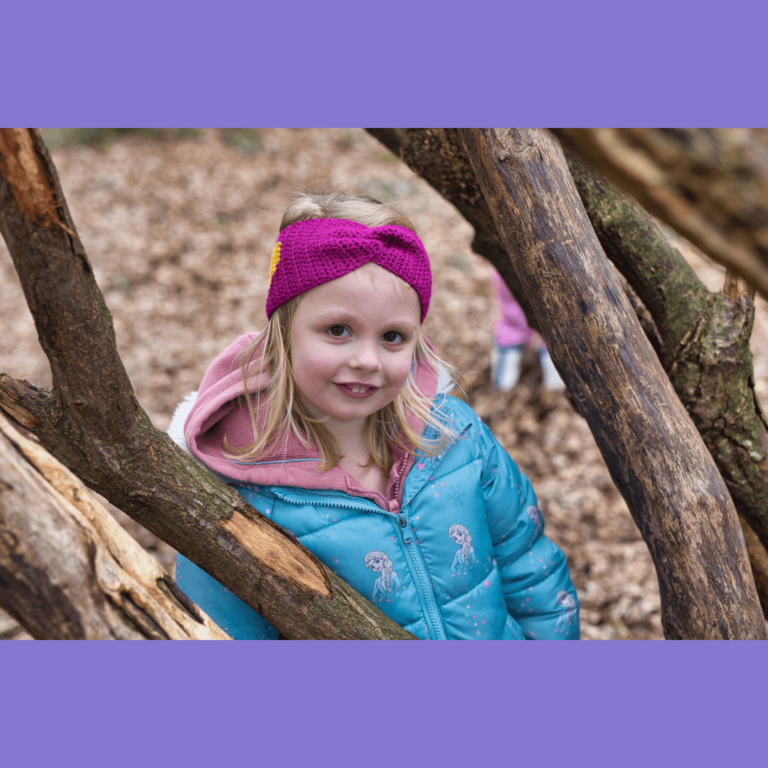 Smiling girl forest branches