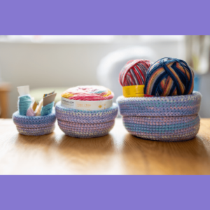 Colorful crocheted yarn storage baskets