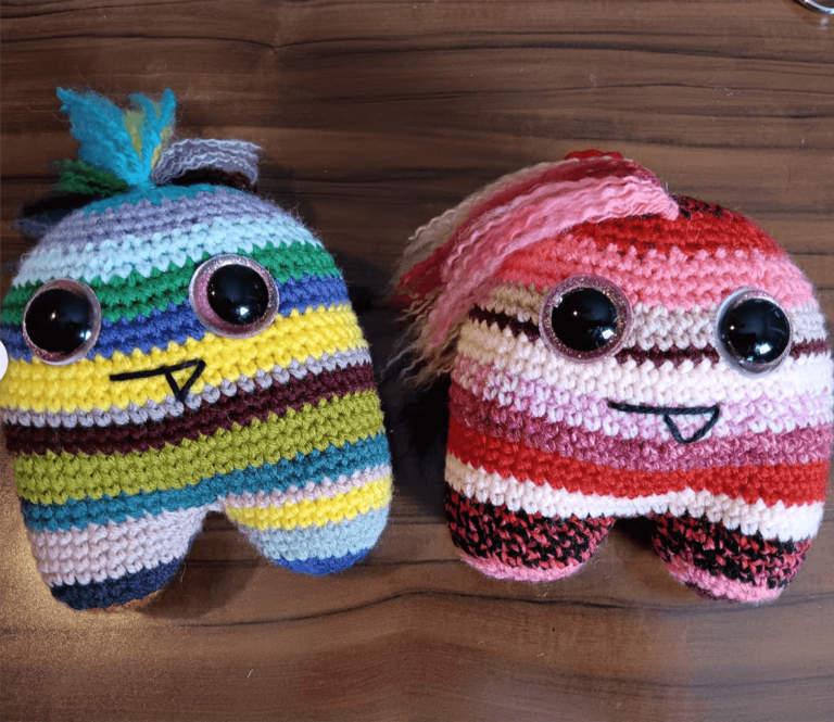 Colorful striped crochet monster plushies