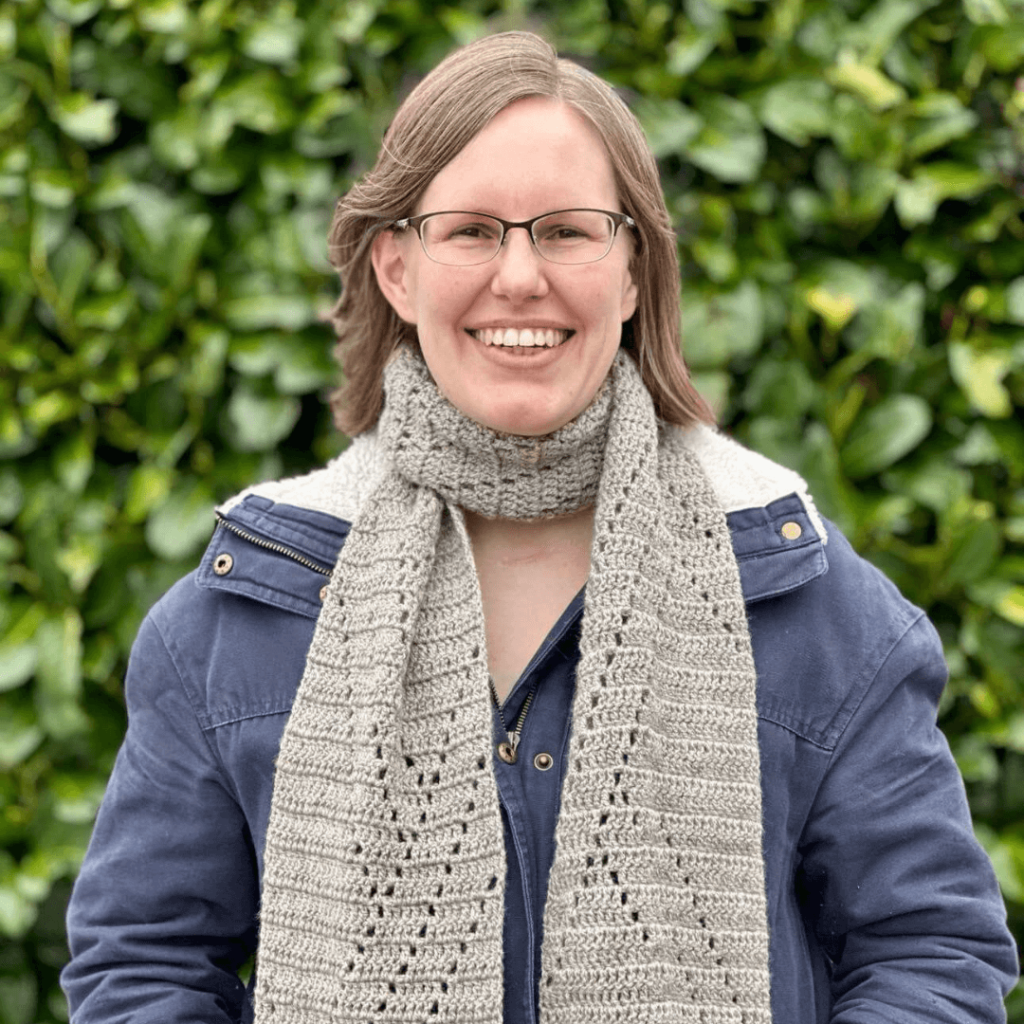 Woman smiling crochet scarf