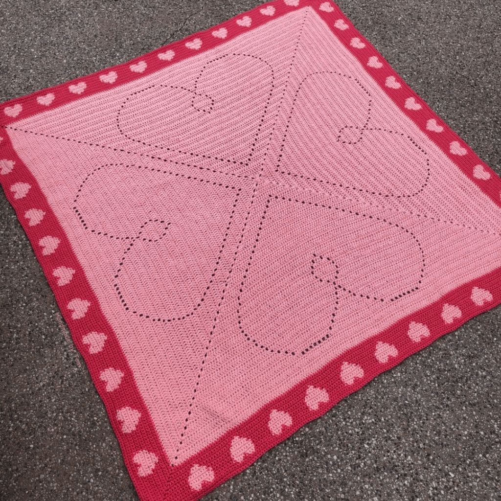 Pink crochet heart blanket