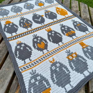 Crochet blanket with pixel birds