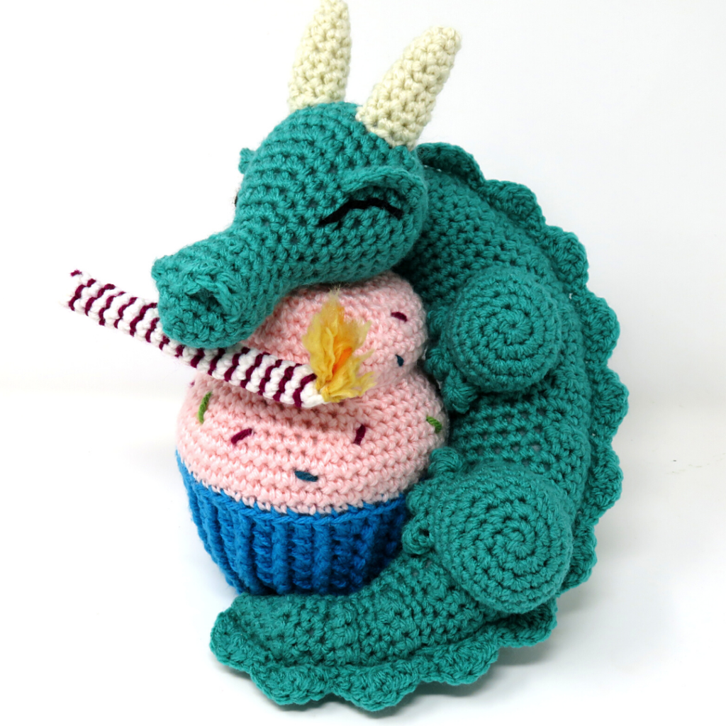 Crochet dragon with cupcake