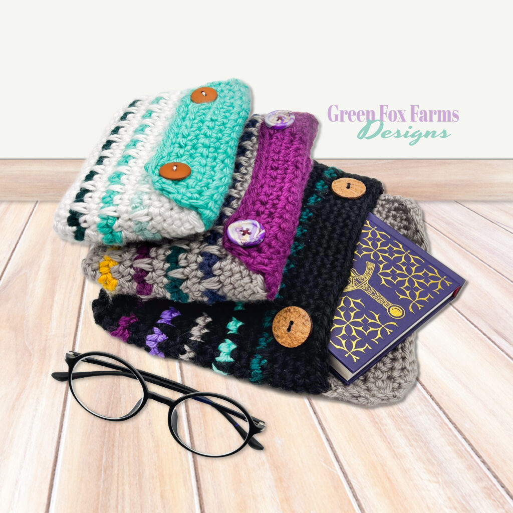 Colorful crocheted book sleeves, book, glasses