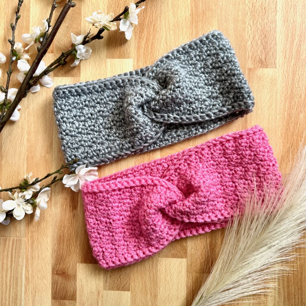 Two crocheted headbands on wood