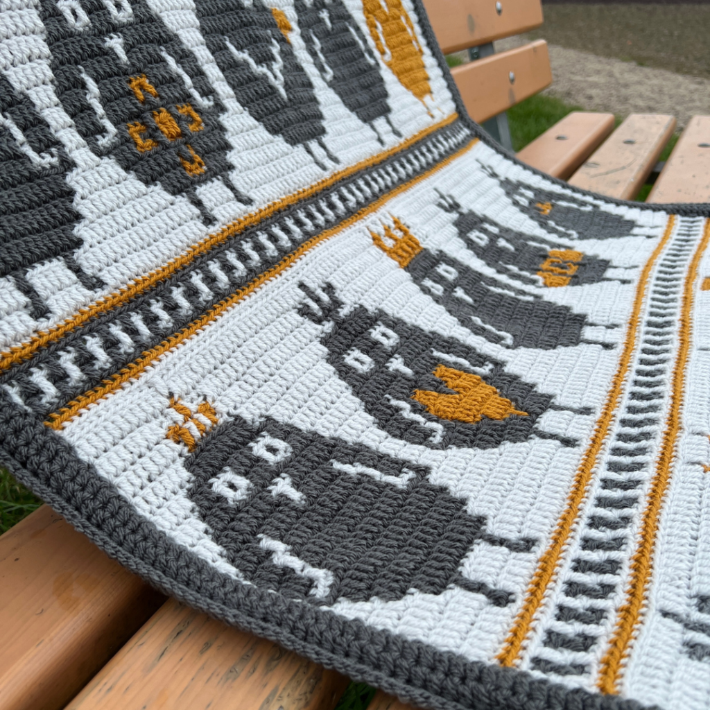 Crochet blanket with bird pattern