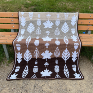 Crocheted autumn blanket on bench
