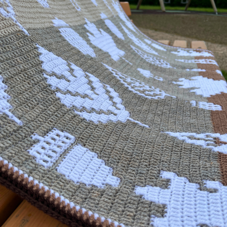 Leaf pattern crochet blanket outdoors