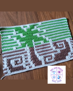 Mosaic crochet piece on wood