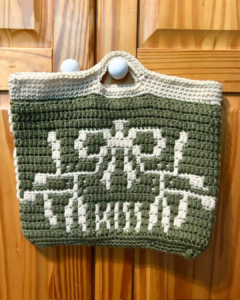 Crocheted bag with 'LOVE KIND'