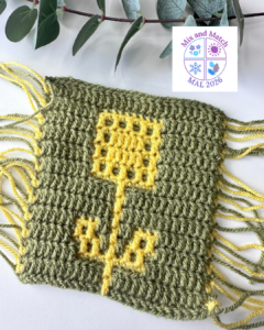 Crochet fabric with yellow flower